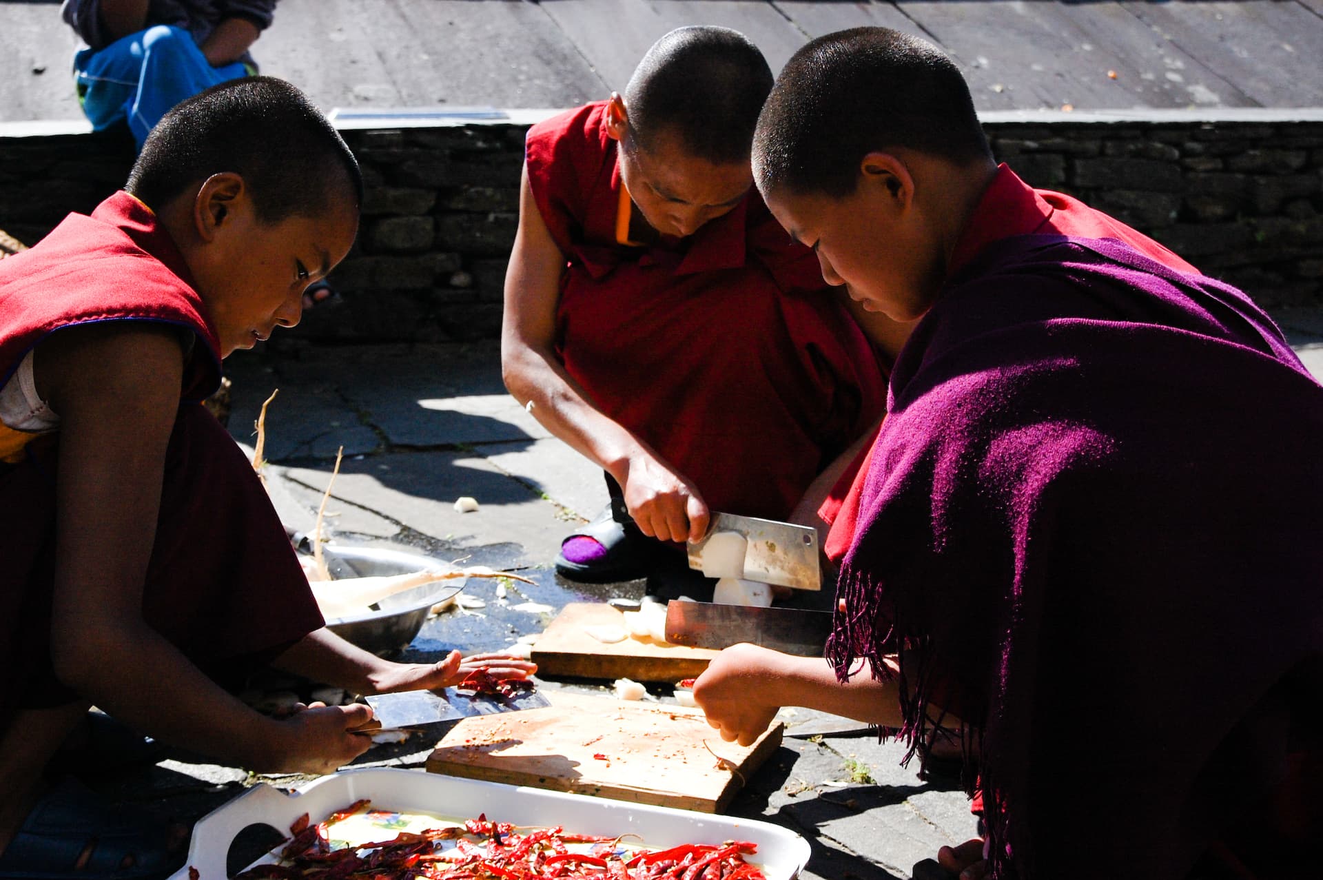 Buddhist monks doing food prep